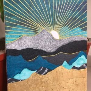 Sun peeks over granite mountain